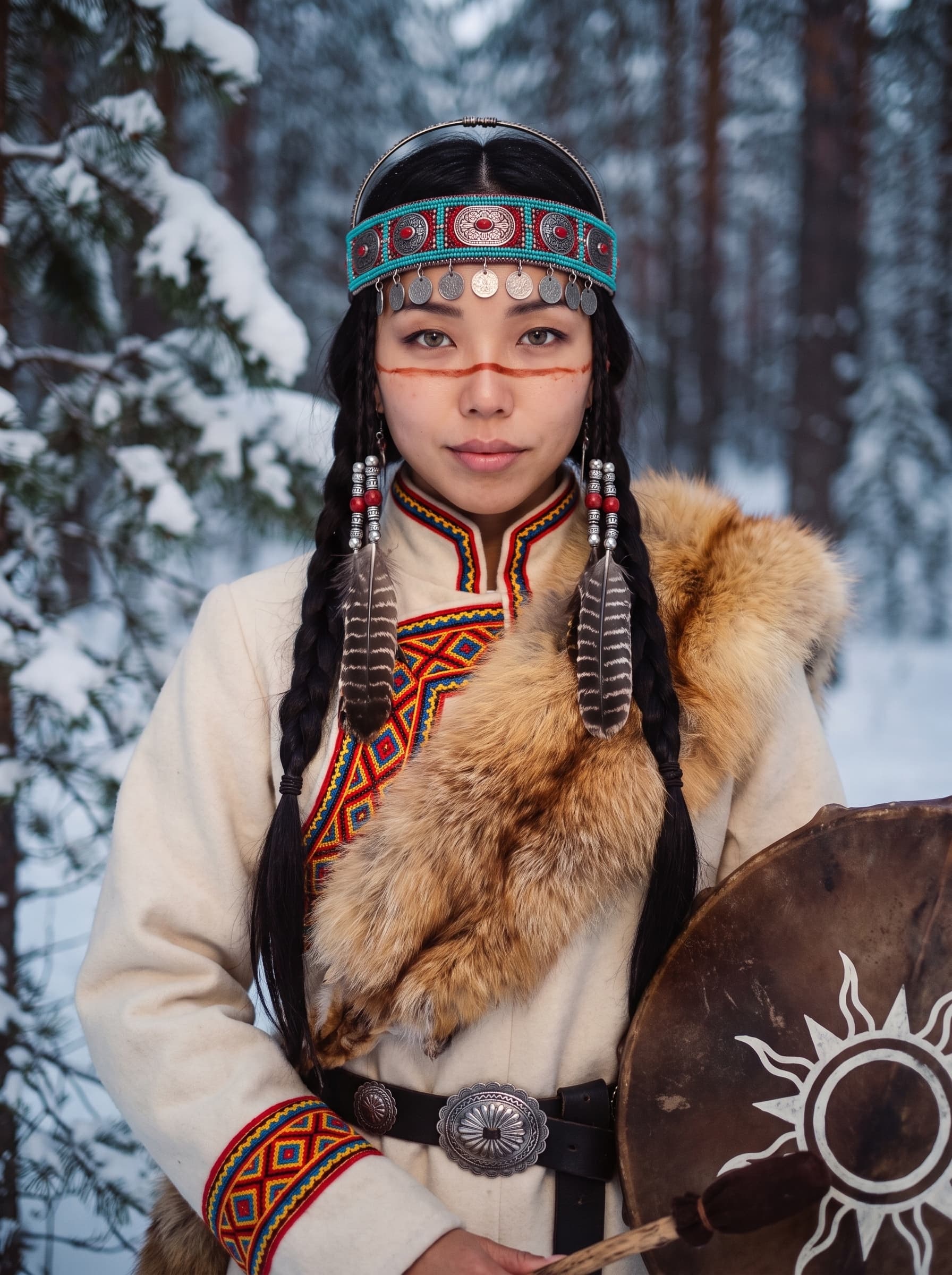 UYANA with long braids, a turquoise beaded headband and a shaman drum, standing in a snowy forest